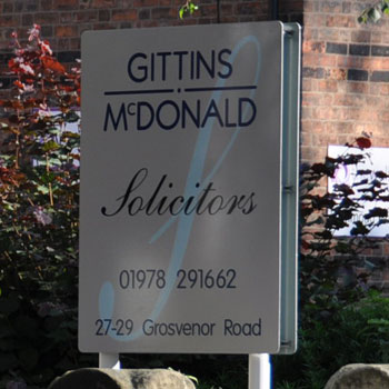 Gittins McDonald Solicitors sign on Grosvenor Road in Wrexham town centre